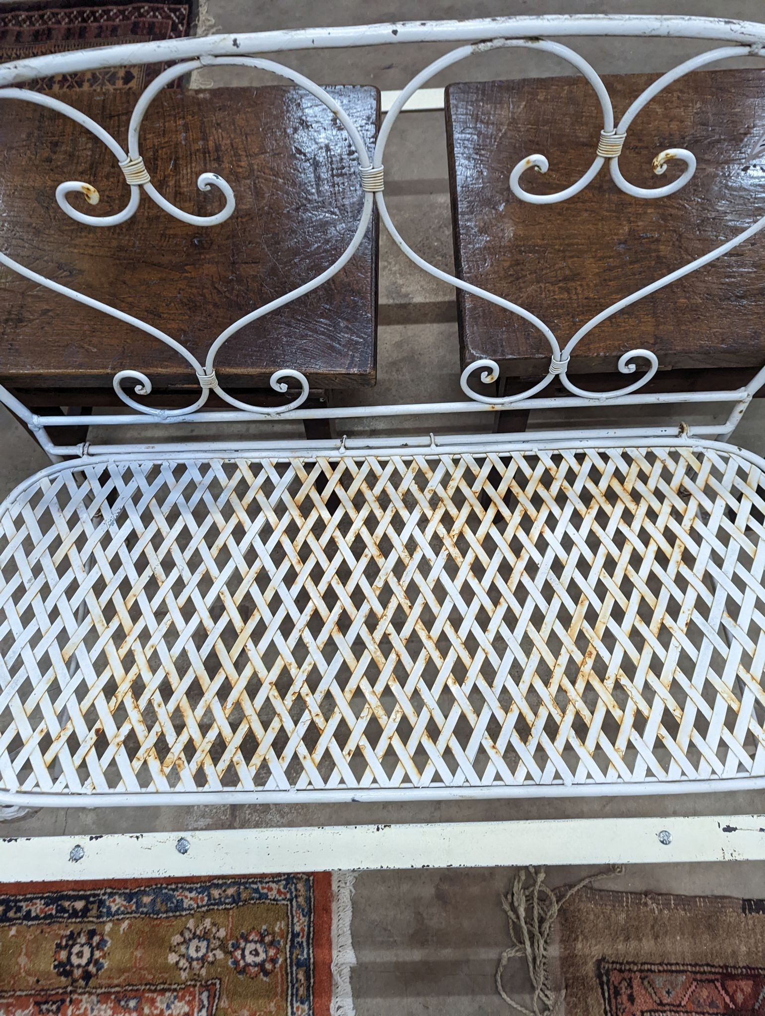 A French wrought iron garden bench, length 135cm, depth 50cm, height 96cm
